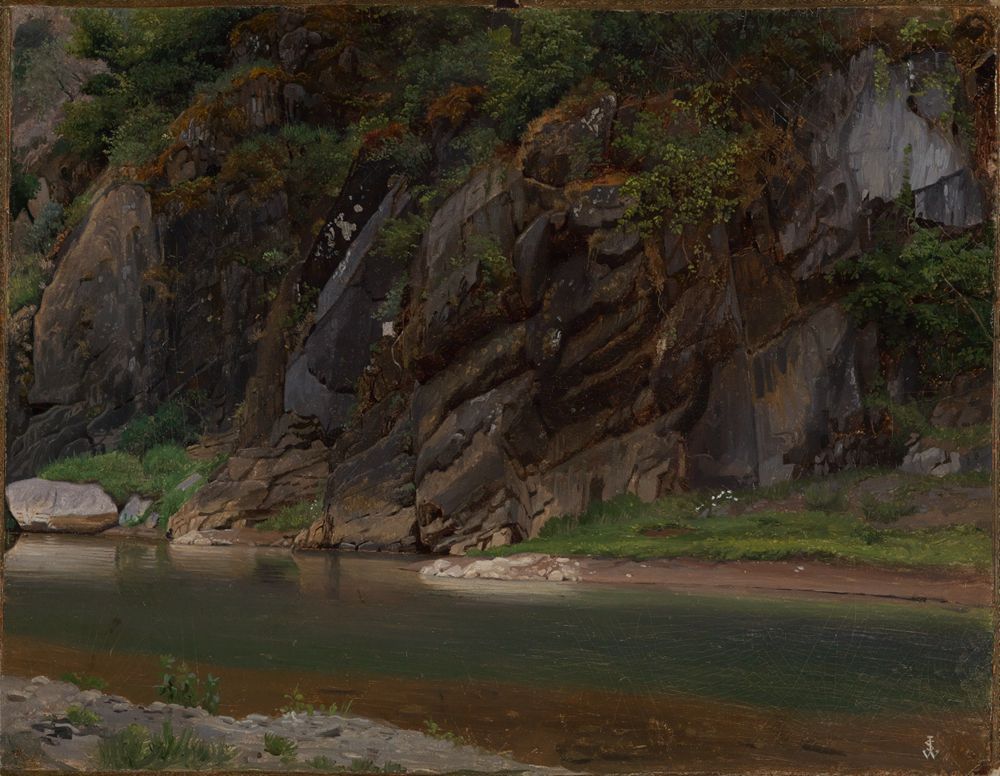 Johann Wilhelm Schirmer zeigt eine dramatische Küstenlandschaft. Ein klarer Fluss schlängelt sich entlang eines felsigen Ufers. Die Felsen sind rau und schroff, während das Wasser ruhig und klar ist.