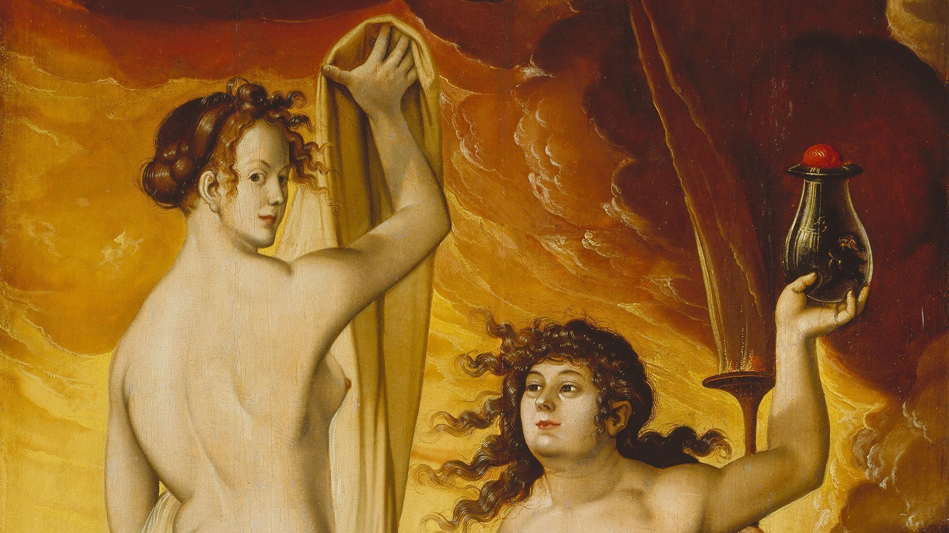 Abbildung des Werks "Zwei Hexen" des Künstlers Hans Baldung Grien. Es zeigt zwei nackte Frauen vor einem orangnen Hintergrund.