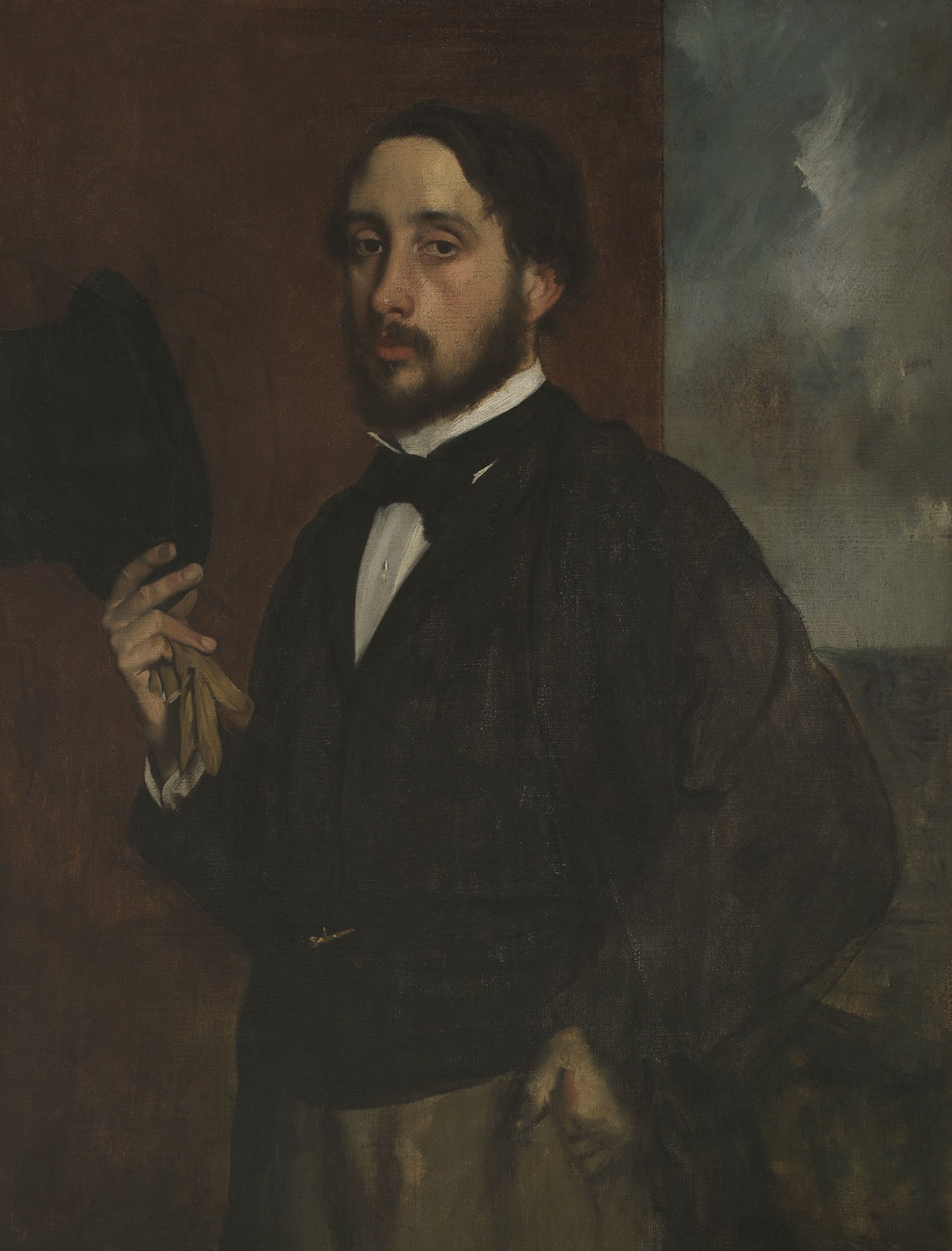 Zu sehen ist ein Selbstportrait des Künstlers Edgar Degas. Er hält in seiner rechten Hand einen Hut.