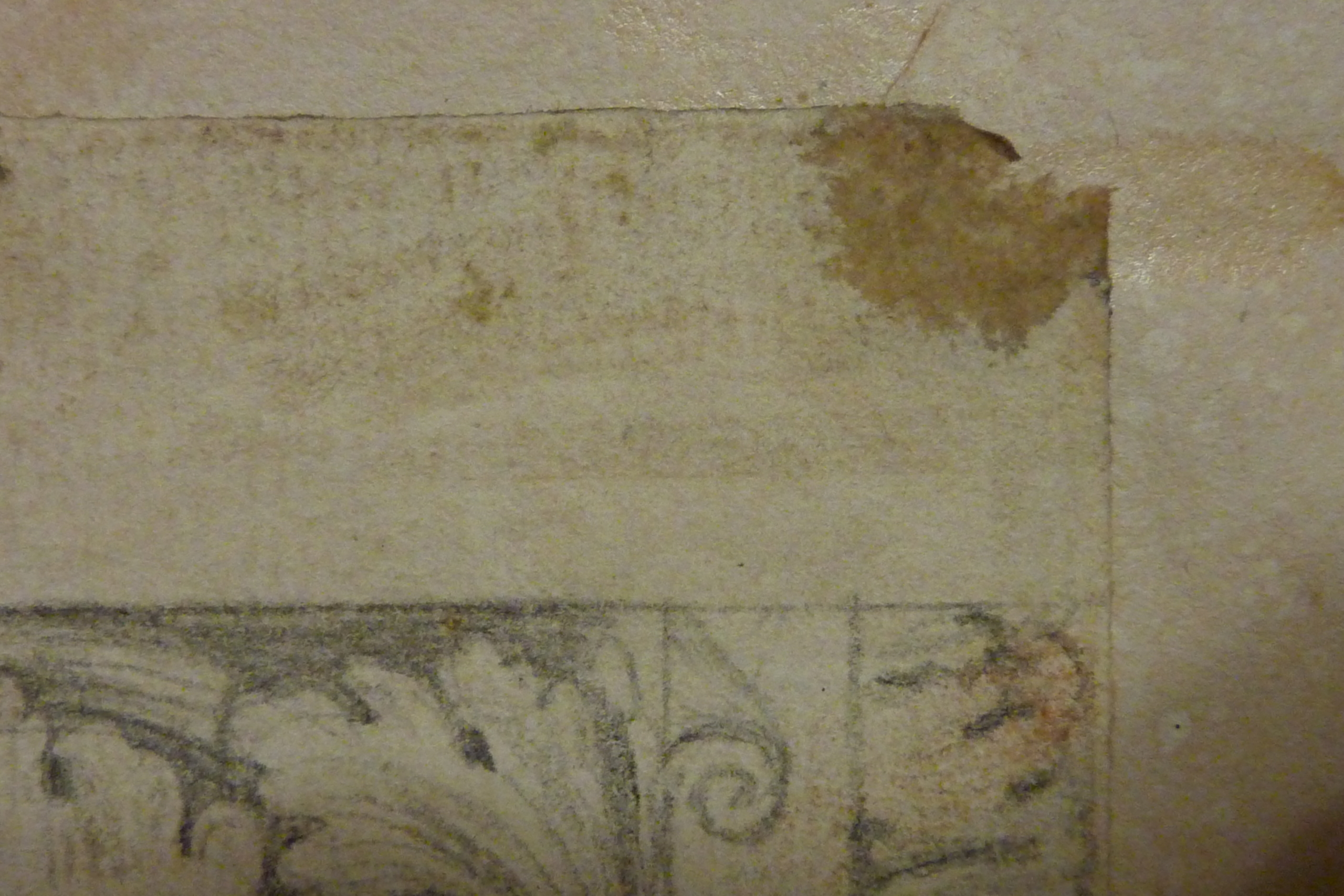 Das Bild zeigt Klebstoff, der an den Ecken eines Papiers angebracht wurde und sich Klebepunkt nennt.