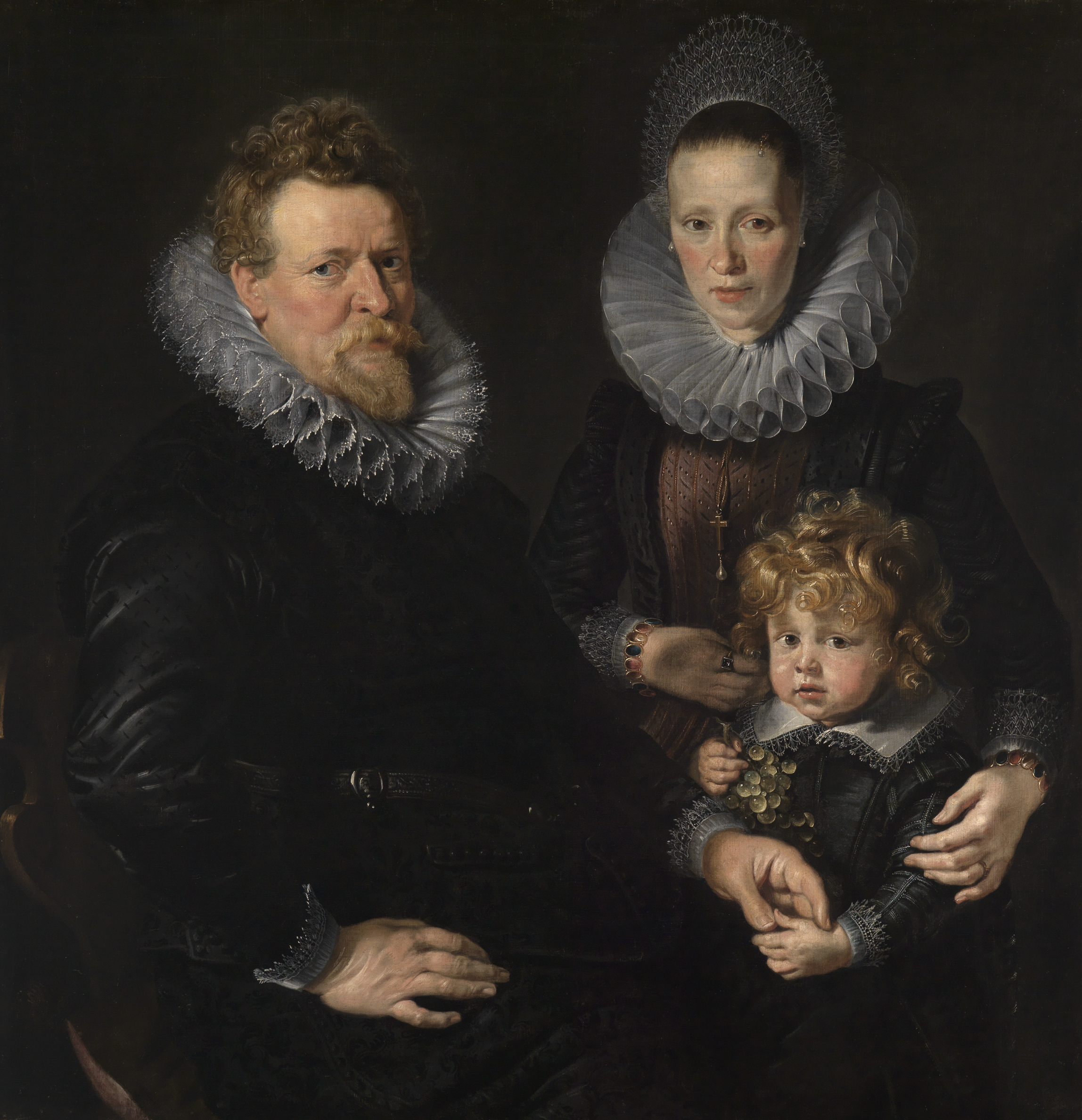 Das Gemälde zeigt ein Porträt des Brüsseler Goldschmieds Robert Staes, seiner Frau Anna und ihres Sohnes Albert.