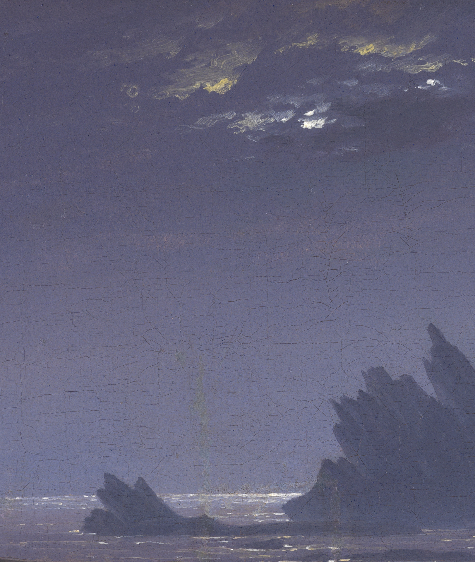 Detail aus Caspar David Friedrichs Felsenriff am Meeresstrand. Mondlicht zwischen den Wolken scheint auf Felsen und Meer.