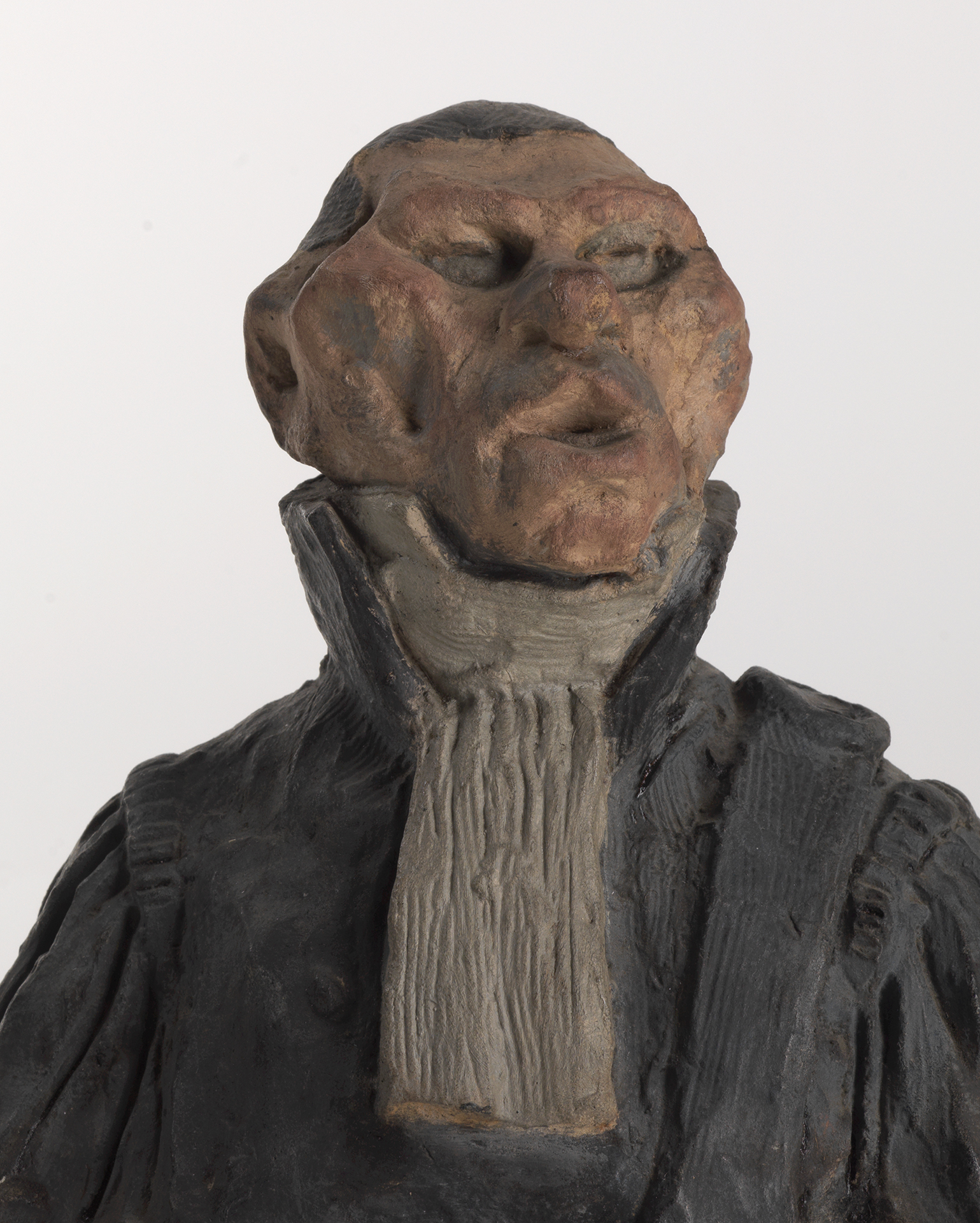Bemalte Tonbüste von Honoré Daumier: André-Marie-Jean-Jacques Dupin mit eingefallenen Wangen und hohen Wangenknochen, das Kinn nach oben gereckt.