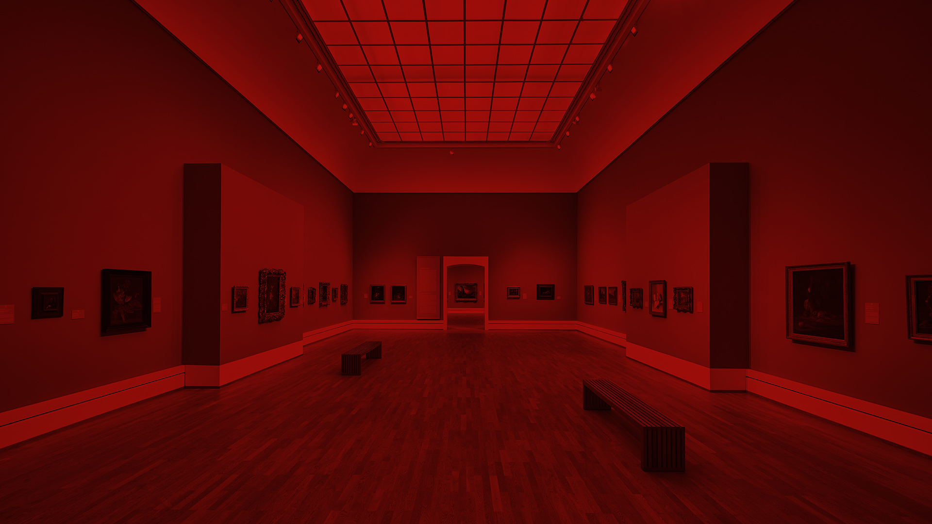 Foto eines Raums in der Staatlichen Kunsthalle Karlsruhe. An der Wand hängen Bilder. Über dem Foto liegt ein roter Filter.