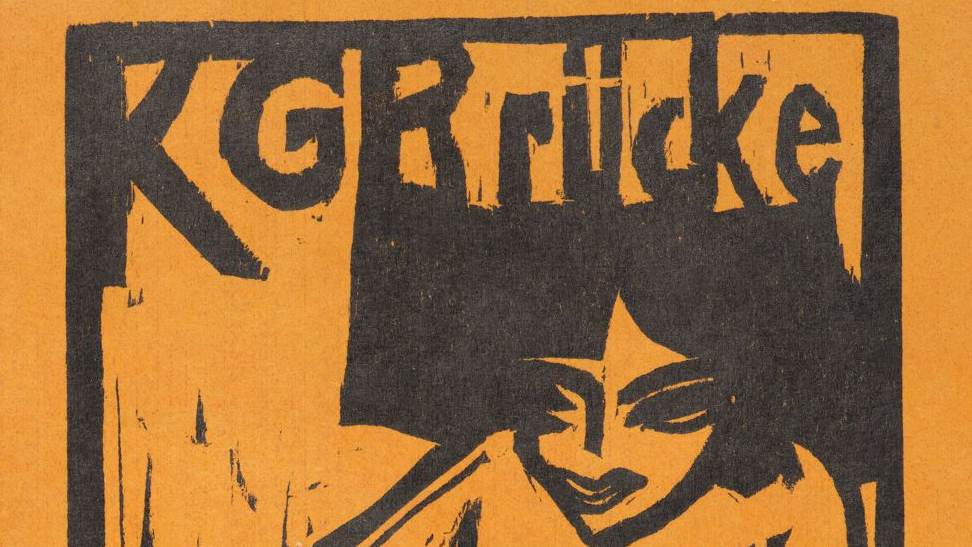 Detail eines Holzschnitts mit dem Text "KG Brücke" oben, darunter der stilisierte Kopf einer Frau.